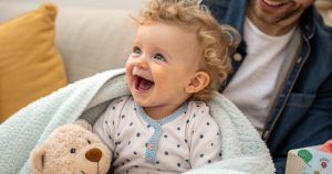 a photo of a baby with baby teeth falling out early