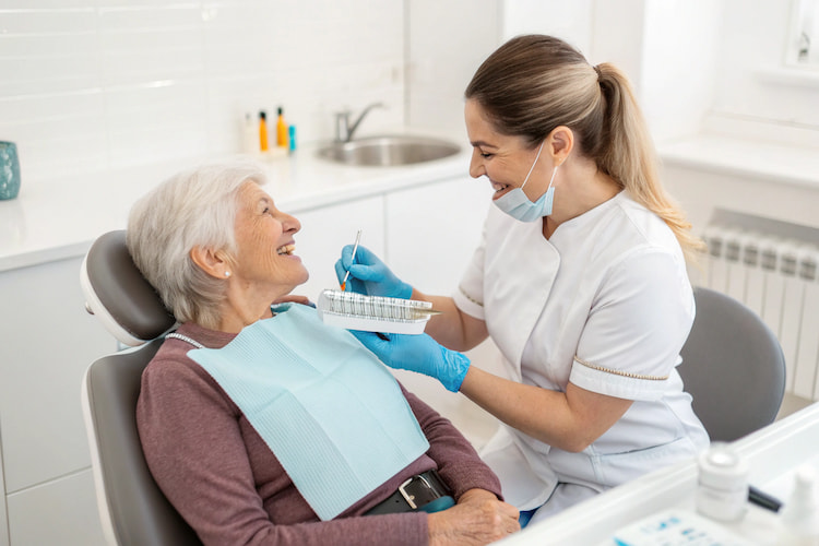 a photo showing a dentist consulting an older adult about alternative options for veneers for older adults 