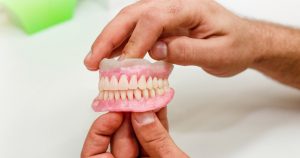 Artificial teeth of full mouth as an example showing denture sores