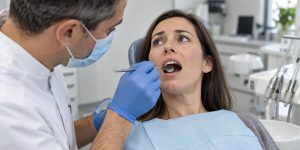 Patient having a broken tooth examined during an emergency dental visit.