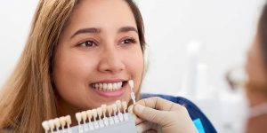 a photo of a lady choosing the best dental veneer type to avoid veneer failure