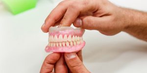Artificial teeth of full mouth as an example showing denture sores